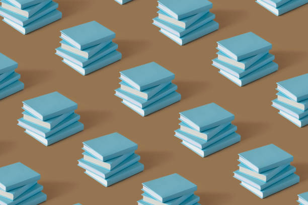 Pattern of blue books on a brown background with soft shadow, copy space. Study, education and Book Lovers Day concept