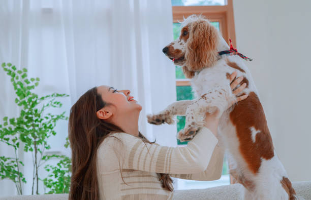 istock Young woman carrying her dog 2164733760
