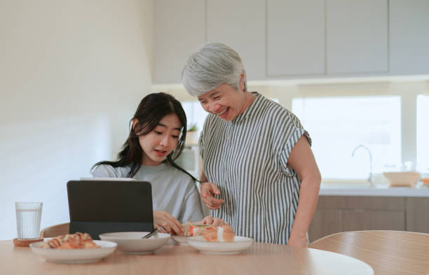 istock Mother preparing food for her daughter 2164734355