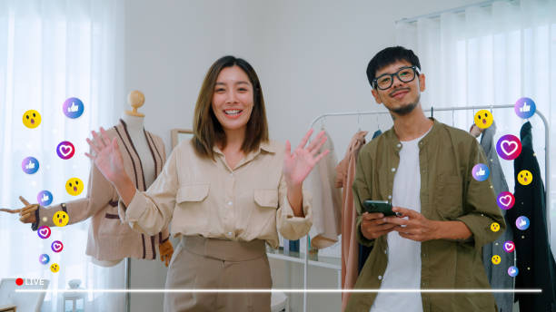 istock Asian couple live streaming for selling clothes 2164734446