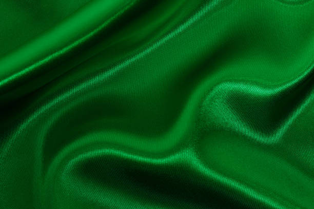 istock Green emerald fabric texture background, detail of silk or linen pattern. 2164737469