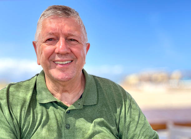 istock Senior Caucasian man selfie outdoors at beach bar 2164741224
