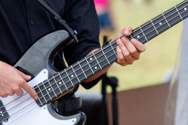istock Men play the guitar. Hands close up 2164743159