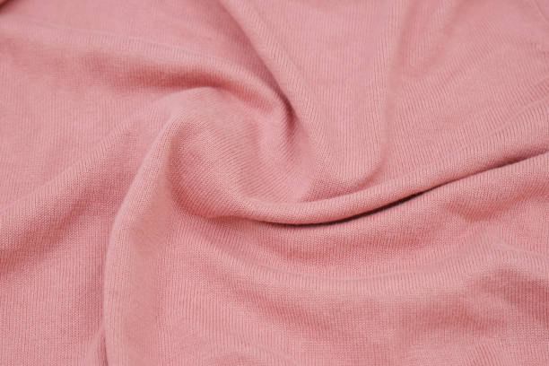 istock Texture of a pink pastel knitted sweater fabric 2164746557