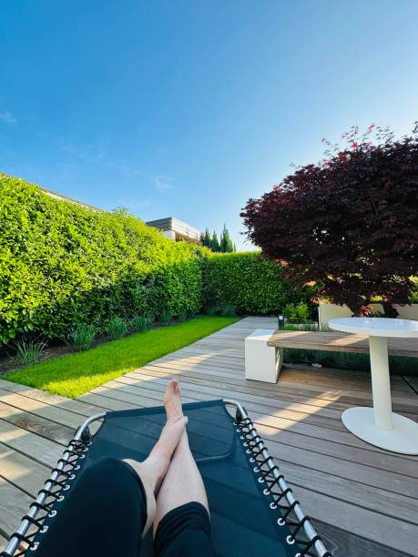 istock Man relaxing on a Sun lounger in the patio 2164749021