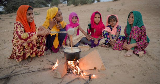 istock Indian children preparing chai - masala tea 2164750280