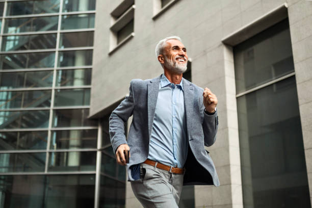 istock Mature Businessman Running to Work 2164751139