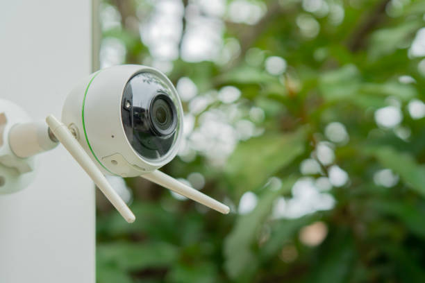 istock CCTV Security Camera or surveillance system. Security camera installed in the garden of a house. 2164751215