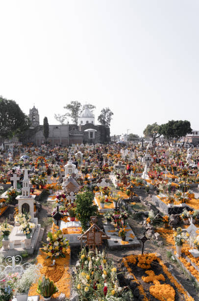 A decorated graveyard during day of the dead in Mexico. Concept of traditional Dia de Muertos celebration