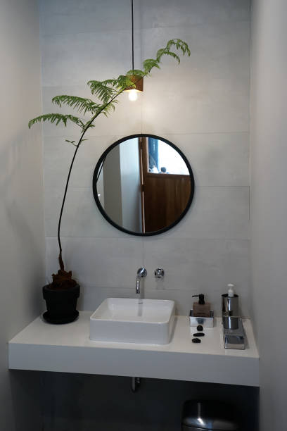 middle age woman combing her hair in the bathroom