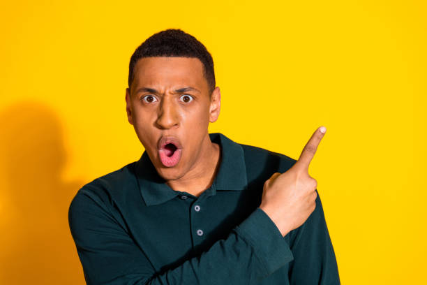 istock Portrait of nice young man direct finger empty space wear pullover isolated on vibrant yellow color background 2164755729