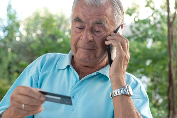 istock Senior Man With Credit Card 2164761756