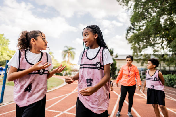 istock Athletes walking and talking on a running track 2164766954