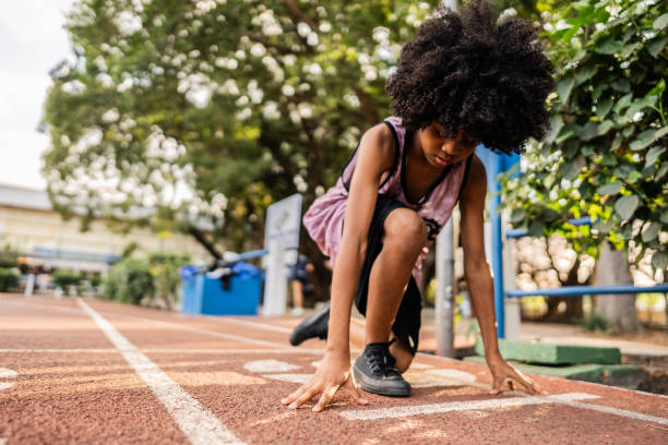 istock Athlete girl practicing on a running track 2164767104