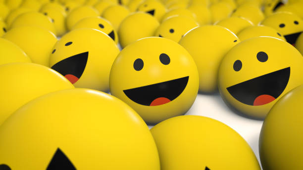 istock A group of bright, yellow emoji balls with smiling faces, indicating laughter and happiness. High resolution image suitable for themes of joy and fun. 2164768125