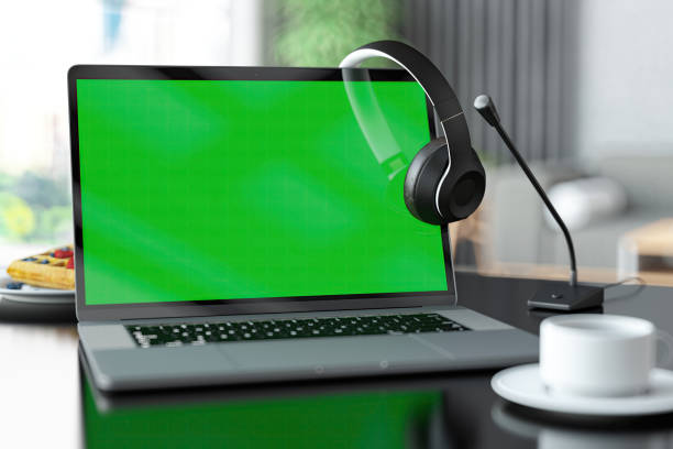 Laptop with Green Screen Headset and Microphone. 3D Render