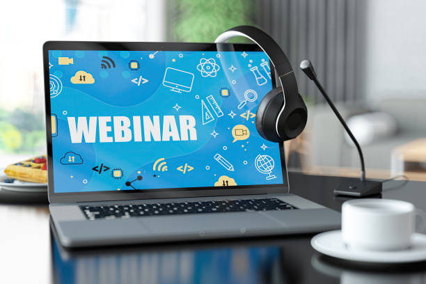 istock Laptop with Webinar Screen on Wooden 2164769741