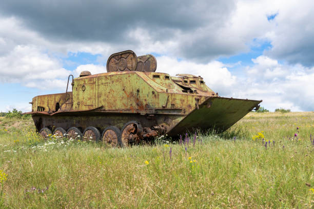istock Rusty old soviet military vehicle wreck in a field 2164769942