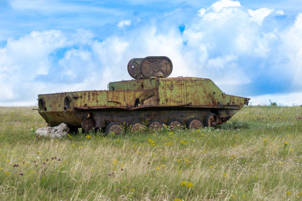 istock Rusty old soviet military vehicle wreck in a field 2164769954