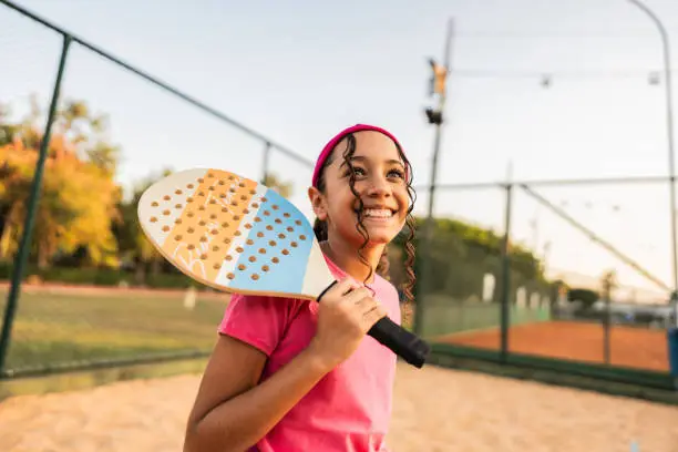 Girl contemplating on tennis beach venue Girl contemplating on tennis beach venue