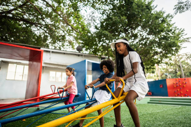 istock Girl playing on seesaw on a playground 2164772748