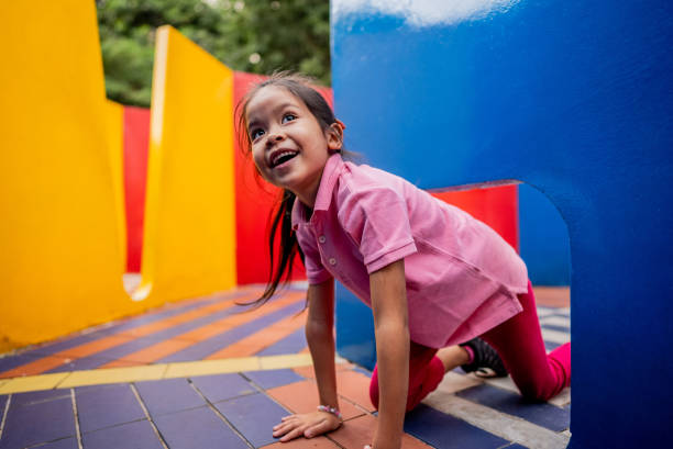 istock Girl playing on labyrinth at playground 2164772793