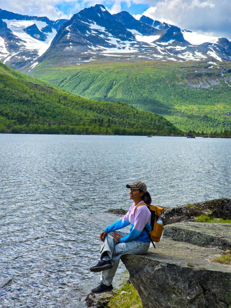 istock Serene Lakeside Relaxation Amidst Norway's Majestic Mountains 2164773310
