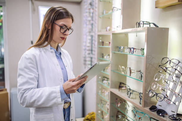 istock Optician reviewing eyeglasses inventory with a tablet 2164774536