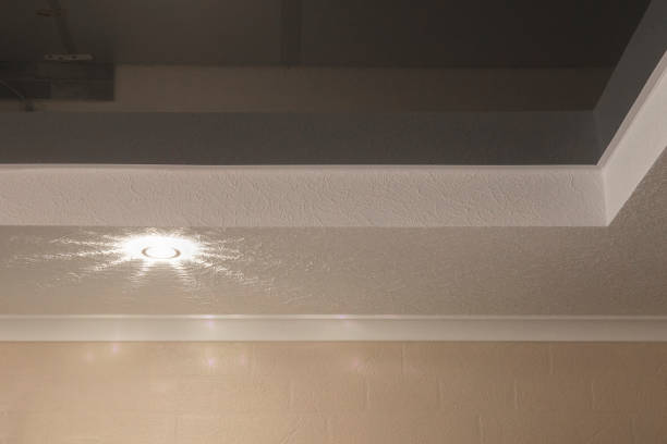 istock White suspended drywall ceiling with grey stretch ceiling and lighter in apartment 2164775245