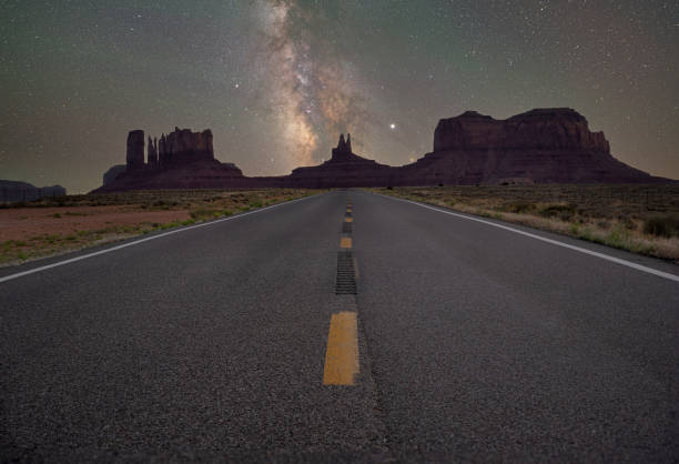istock Road Through Monument Valley Under The Night Sky 2164775703