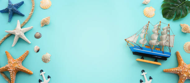 istock nautical concept seashells and starfish over blue background 2164776636