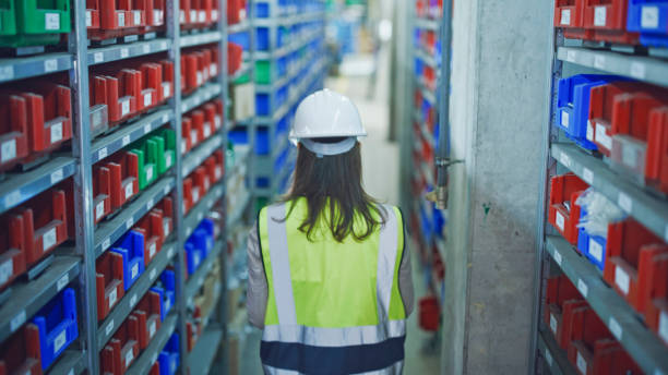istock Female Manager Checking Inventory in Factory 2164777219