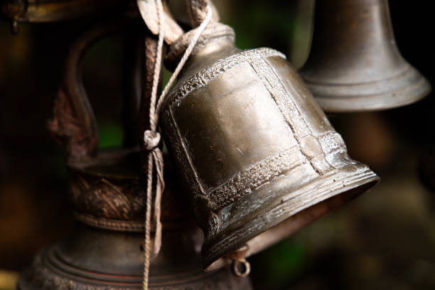 istock An antique brass bells hanging in buddhism temple 2164777765