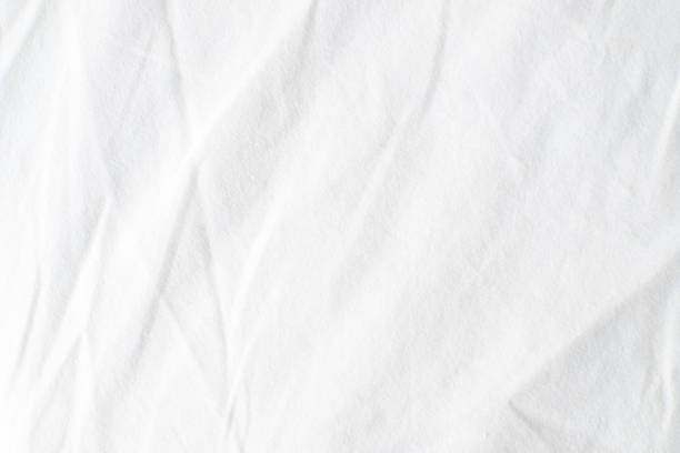 istock Abstract White Bedding Sheets or White wrinkled fabric background texture and Texture with copy-space :Creased or wrinkled white fabric,Soft focus 2164782602
