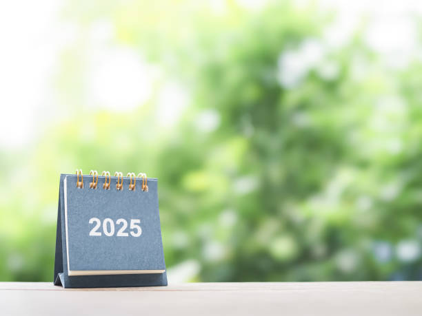 istock Close up 2025 desk calendar on the table with copy space. Resolution, Goal, Action, Planning, and manage to success business. 2164784241