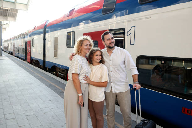 istock Family at a railway station platform 2164785493