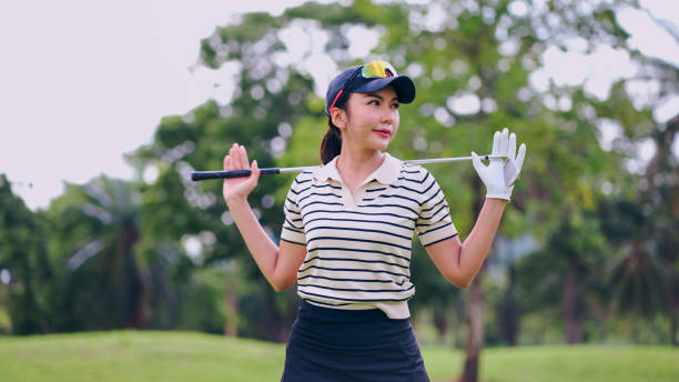 istock Athletic lady training with club in hand before golf competition. 2164785771