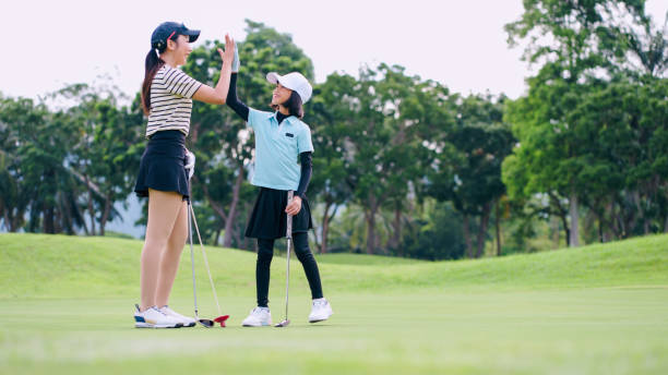 istock Golf training for children, Children practice swing. 2164785778
