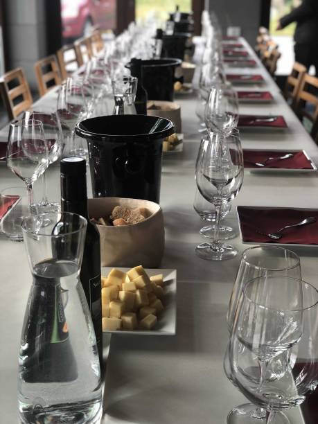 istock Elegant Dining Setup Featuring Wine, Cheese, and Glassware in Modern Restaurant During Afternoon Gathering 2164785931