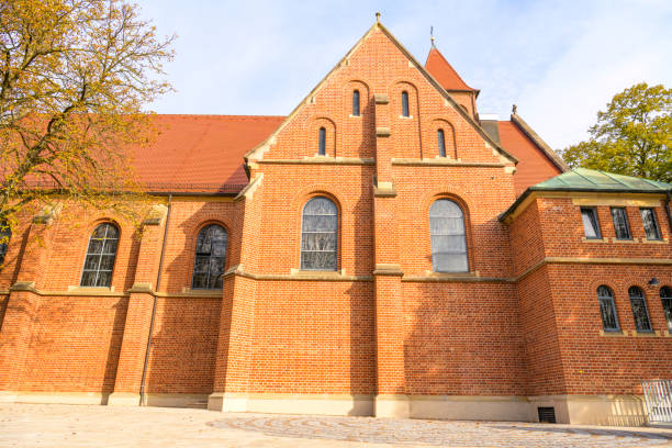 Kirchheim Teck, Baden-Württemberg, Germany, October 18 2023: Red brick church - St. Ulrich side view catholic church