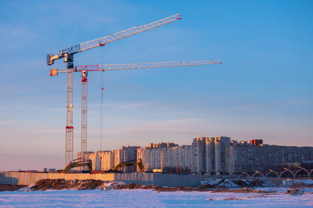 istock Construction. Tower crane. Construction of new high-rise buildings. Urban development. Construction of houses. Buying an apartment in a new house. Apartments from the developer. 2164790752