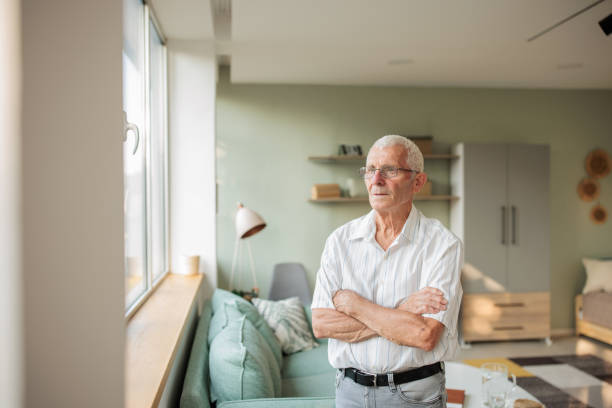 istock Portrait of a senior man at home 2164792202