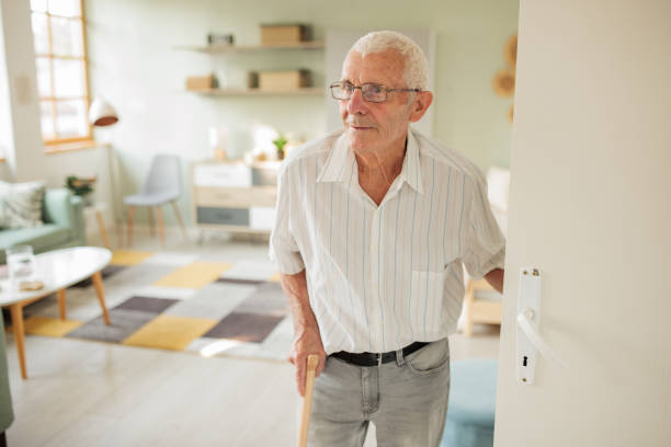 Portrait of a senior Caucasian man in the living room of his apartment