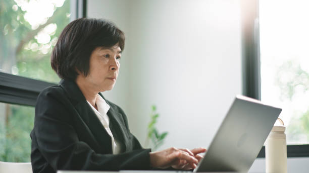 istock Mature woman working on laptop. 2164799619