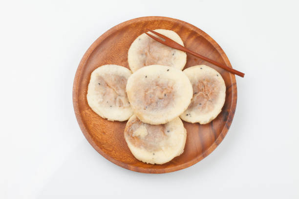 istock Knead flour or glutinous rice powder, add sugar and bake it in a round shape on a griddle or frying pan. 2164801242