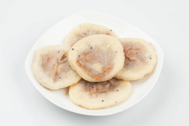 Knead flour or glutinous rice powder, add sugar and bake it in a round shape on a griddle or frying pan.