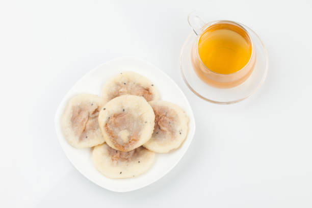 Knead flour or glutinous rice powder, add sugar and bake it in a round shape on a griddle or frying pan.