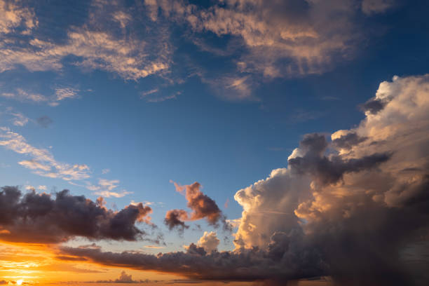 istock Bright colorful orange and yellow clouds on horizon. Beautiful sunset sky scenery 2164801556
