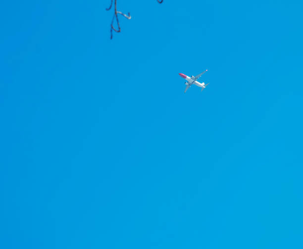 Airplane against a background of blue sky on a sunny day.