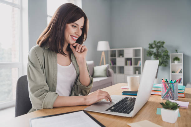 istock Photo of charming happy lady assistant boss speak interviewee online talk discuss skill knowledge comfort workstation office home indoor 2164803027